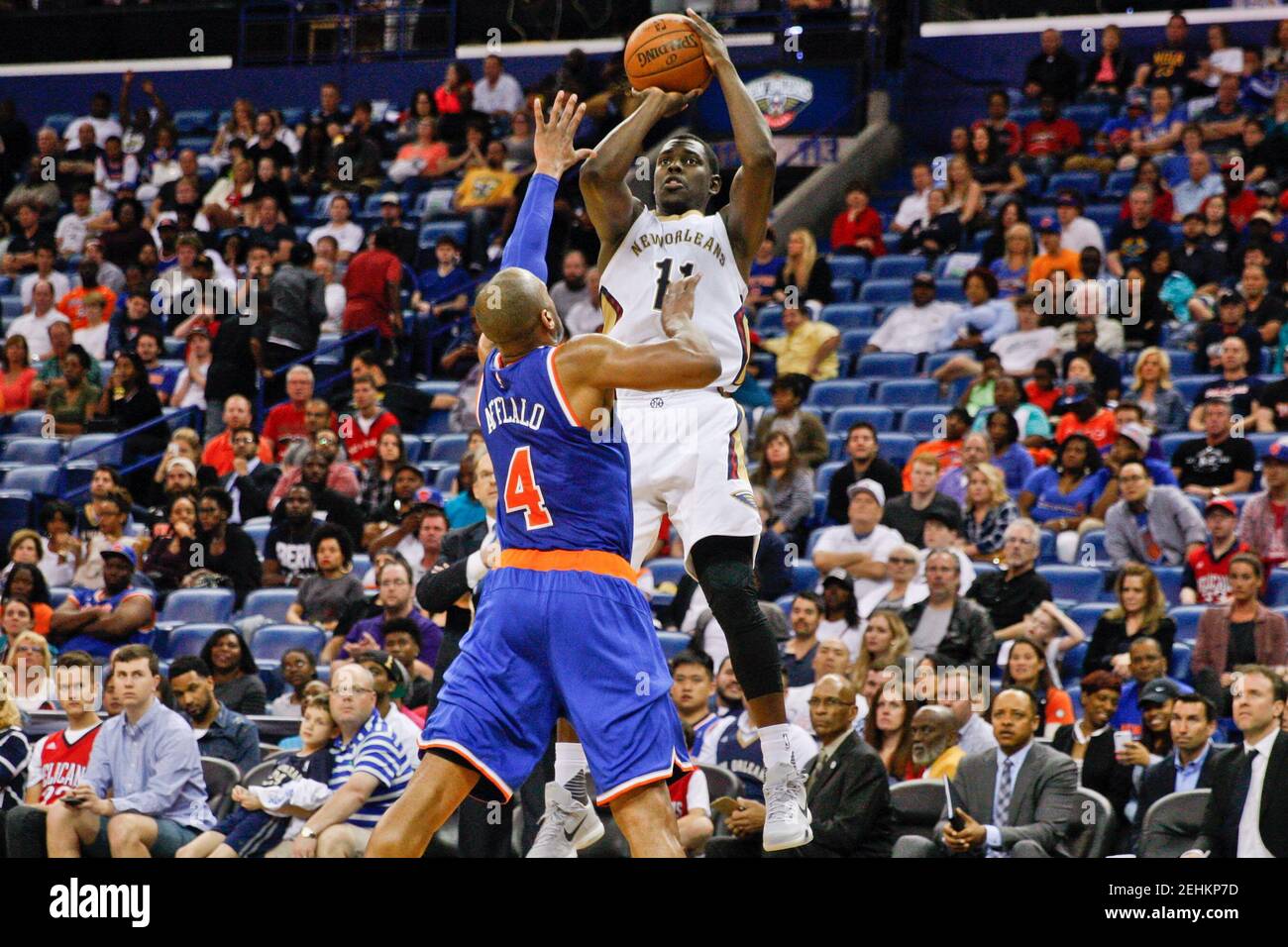Mar 28, 2016; New Orleans, LA, USA; New Orleans Pelicans guard Jrue Holiday (11) shoots over New York Knicks guard Arron Afflalo (4) during the second half of a game at the Smoothie King Center. The Pelicans defeated the Knicks 99-91. Mandatory Credit: Derick E. Hingle-USA TODAY Sports  / Reuters  Picture Supplied by Action Images   (TAGS: Sport Basketball NBA) *** Local Caption *** 2016-03-29T030940Z 872434843 NOCID RTRMADP 3 NBA-NEW-YORK-KNICKS-AT-NEW-ORLEANS-PELICANS.JPG Stock Photo