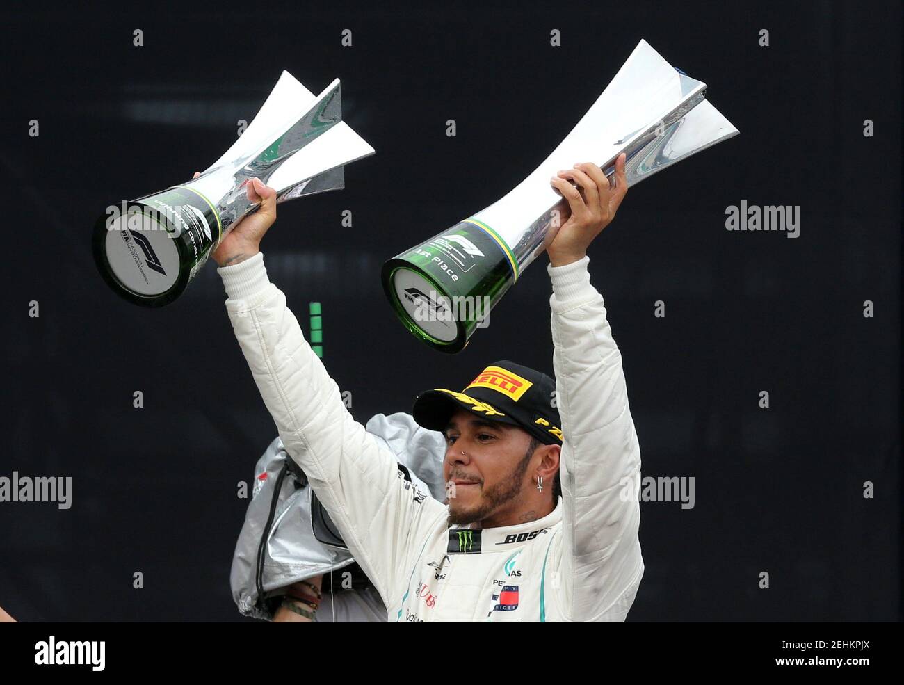 Formula One F1 - Brazilian Grand Prix - Autodromo Jose Carlos Pace, Interlagos, Sao Paulo, Brazil - November 11, 2018  Mercedes' Lewis Hamilton celebrates after winning the race with the constructors championship trophy and the race trophy  REUTERS/Paulo Whitaker Stock Photo