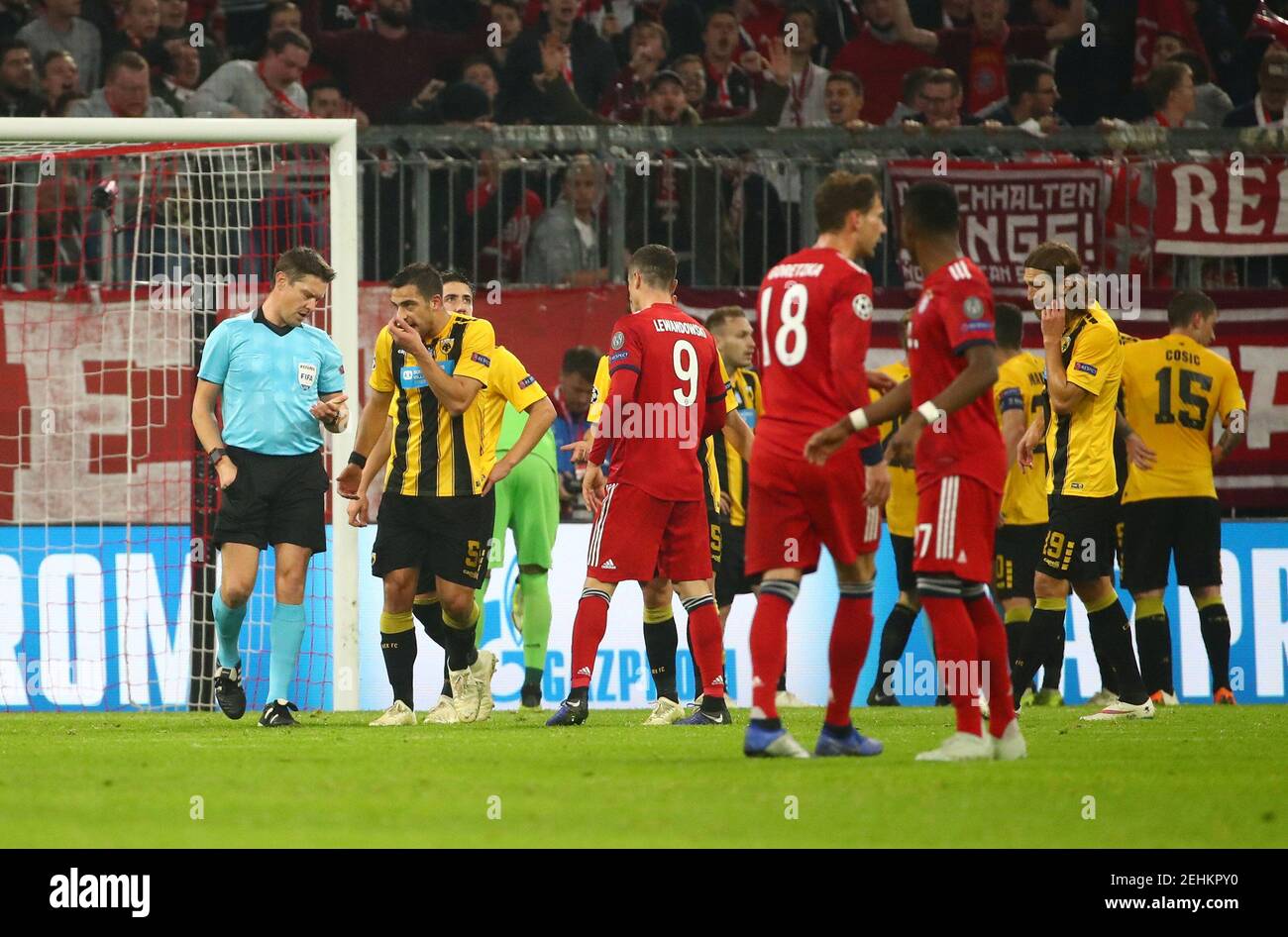 Soccer Football - Champions League - Group Stage - Group E - Bayern Munich v AEK Athens - Allianz Arena, Munich, Germany - November 7, 2018  AEK Athens' Vasilis Lampropoulos remonstrates with referee Matej Jug after a penalty is awarded to Bayern Munich  REUTERS/Michael Dalder Stock Photo