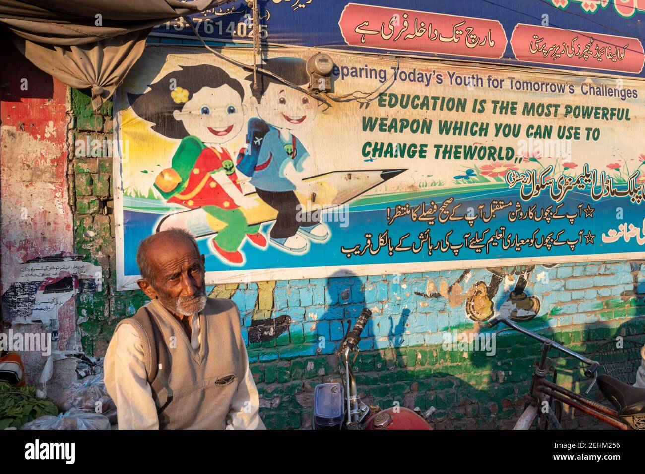 Billboard On A Street Wall For Promoting Education, Jhang, Punjab, Pakistan Stock Photo