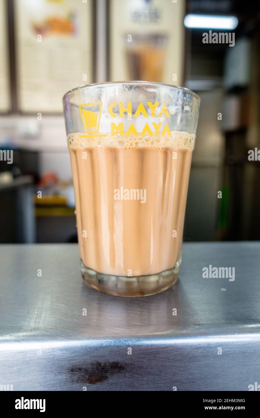 Indian tea served in a traditional glass cup at a tea stall Stock Photo