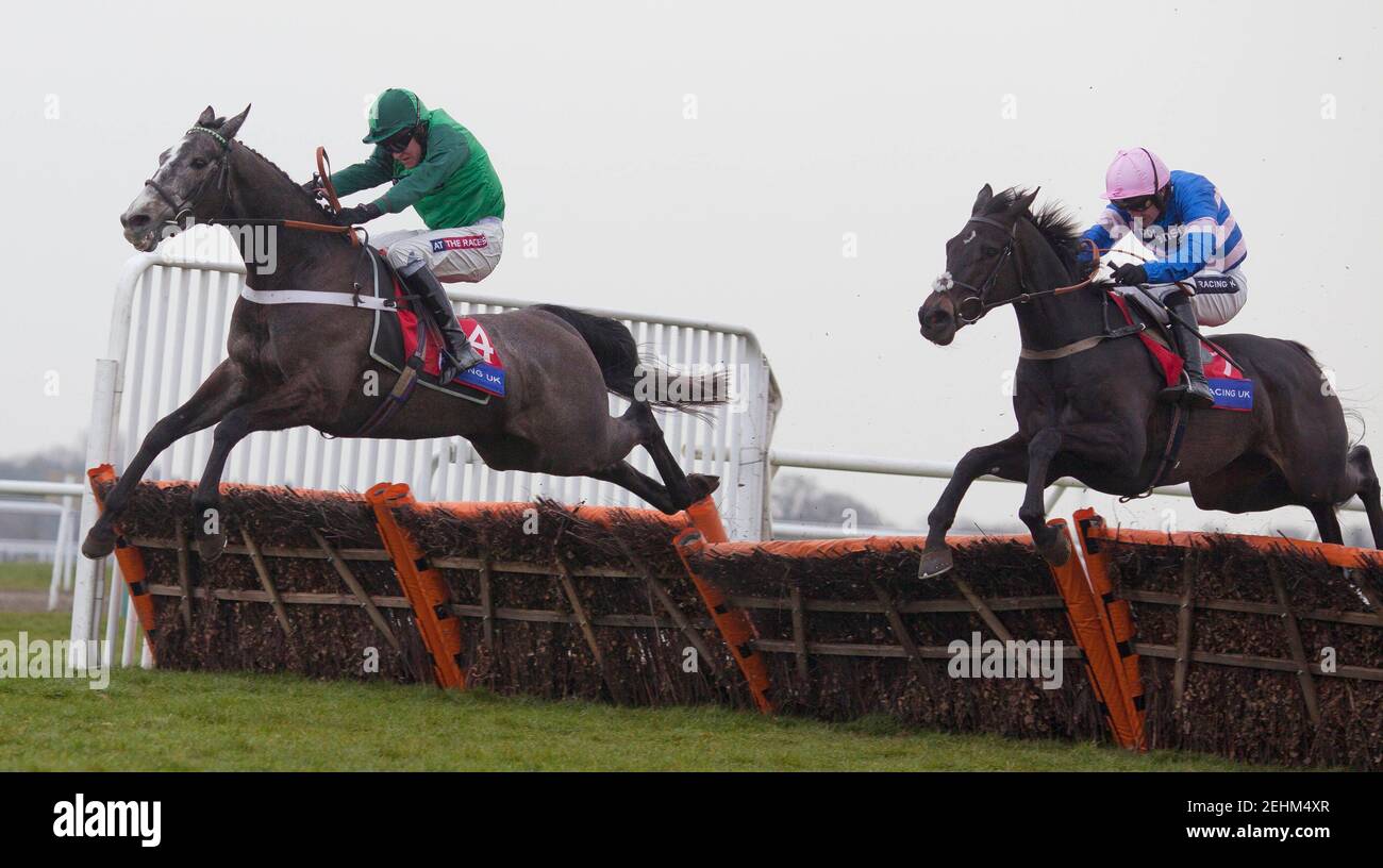 Horse Racing - Racing Plus Chase  - Kempton Park Racecourse - 23/2/13  Irish Saint ridden by Ruby Walsh (R) before winning the 14.05 Racing UK Subscribe For Cheltenham Adonis Juvenile Hurdle ahead of Vasco du Ronceray ridden by Barry Geraghty  Mandatory Credit: Action Images / Julian Herbert  Livepic Stock Photo