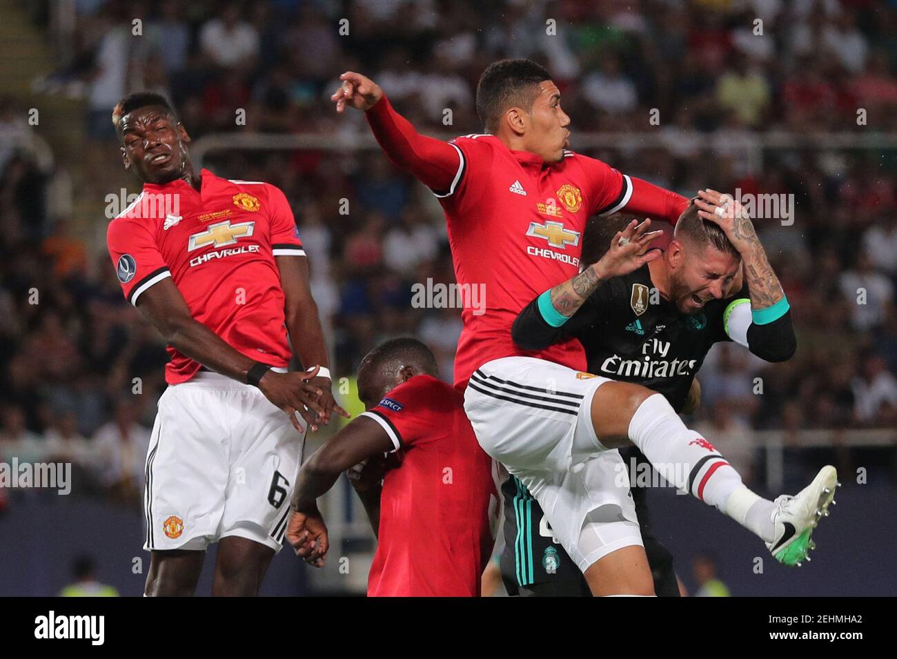 Soccer Football - Real Madrid v Manchester United - Super Cup Final - Skopje, Macedonia - August 8, 2017   Real Madrid’s Sergio Ramos in action with Manchester United's Chris Smalling and Paul Pogba   REUTERS/Eddie Keogh Stock Photo