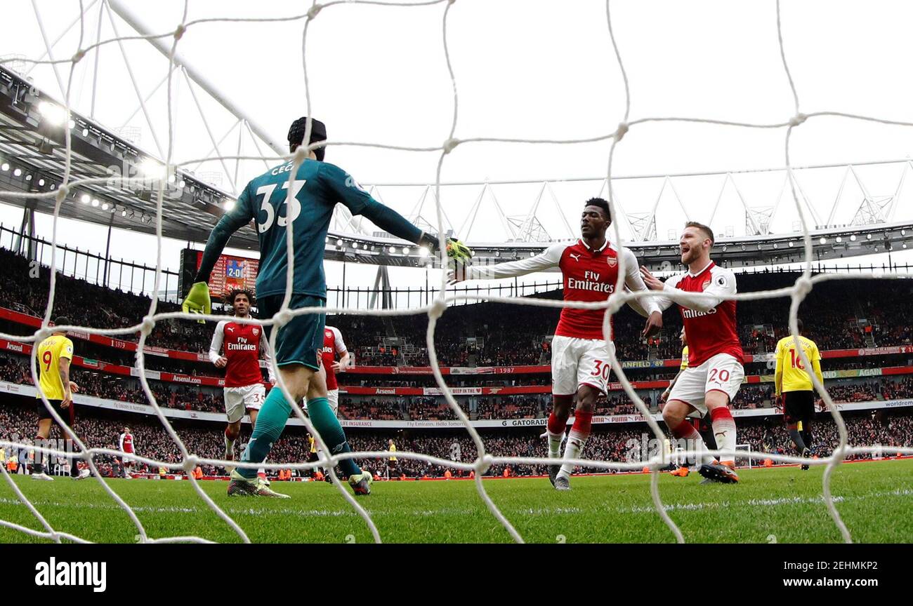 Soccer Football - Premier League - Arsenal vs Watford - Emirates Stadium, London, Britain - March 11, 2018   Arsenal's Petr Cech celebrates with team mates after saving a penalty    REUTERS/Eddie Keogh    EDITORIAL USE ONLY. No use with unauthorized audio, video, data, fixture lists, club/league logos or "live" services. Online in-match use limited to 75 images, no video emulation. No use in betting, games or single club/league/player publications.  Please contact your account representative for further details. Stock Photo