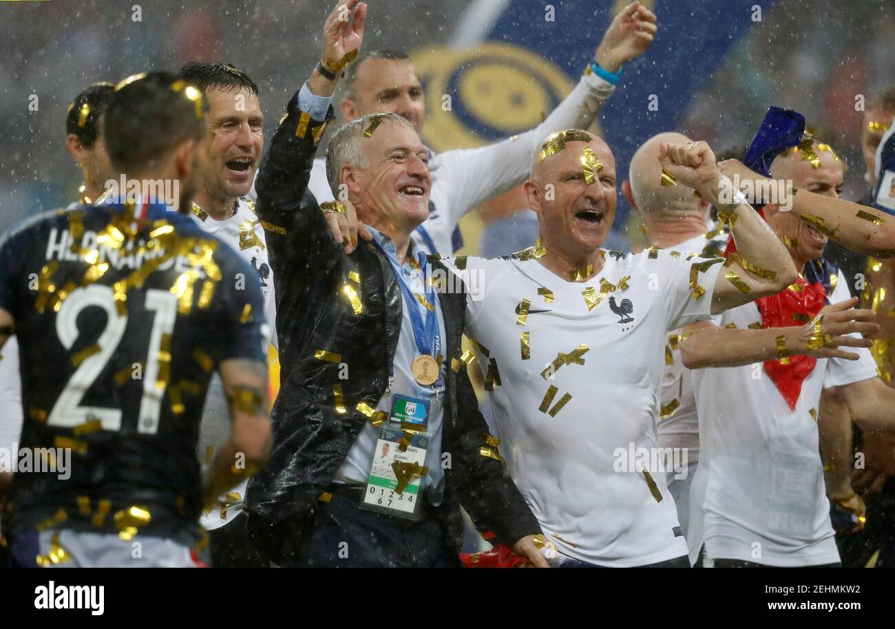 Soccer Football - World Cup - Final - France v Croatia - Luzhniki Stadium, Moscow, Russia - July 15, 2018  France coach Didier Deschamps celebrates with France staff and players after winning the World Cup  REUTERS/Damir Sagolj Stock Photo
