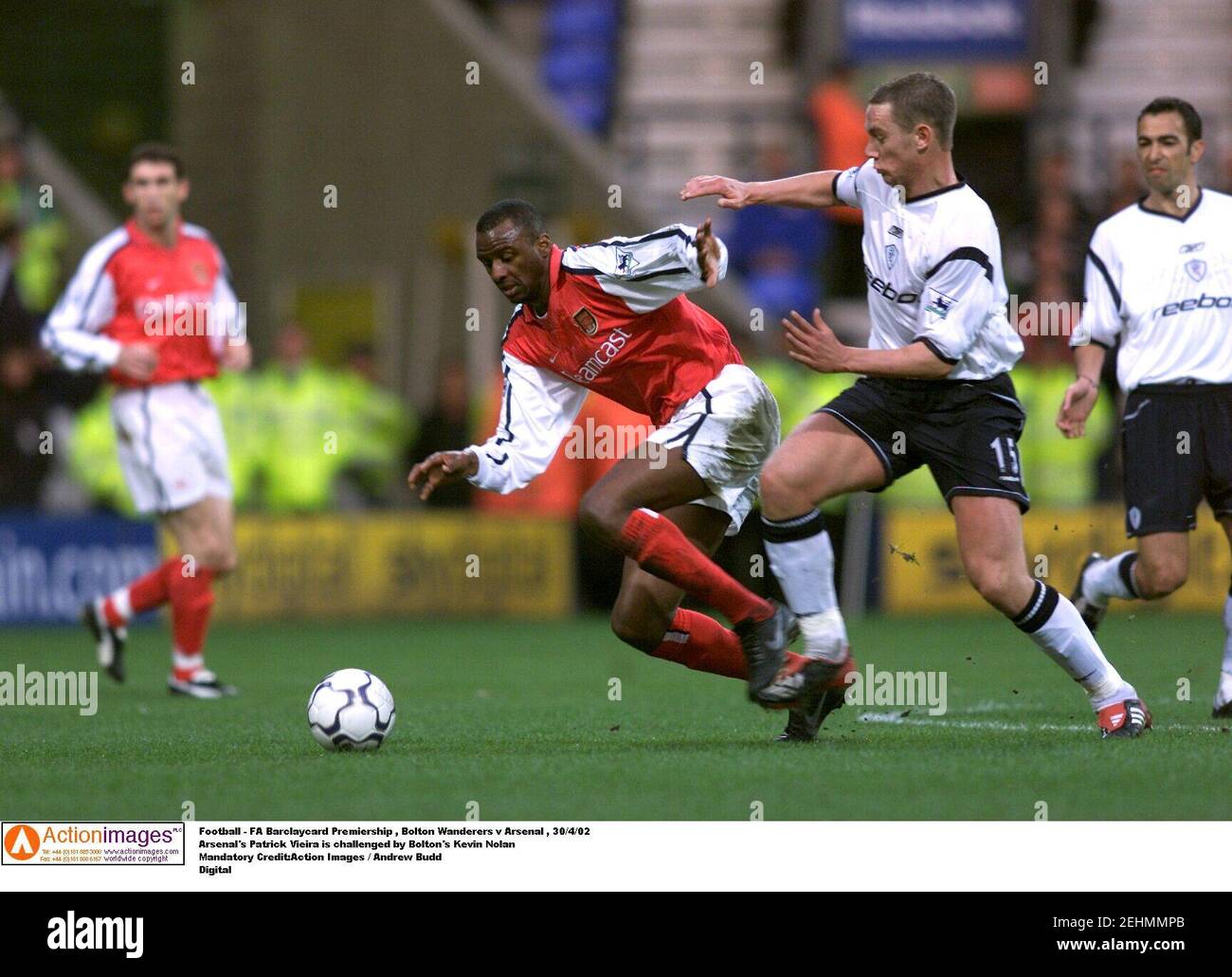 Football - FA Barclaycard Premiership , Bolton Wanderers v Arsenal , 29/4/02  Arsenal's Patrick Vieira is challenged by Bolton's Kevin Nolan  Mandatory Credit:Action Images / Andrew Budd  Digital Stock Photo