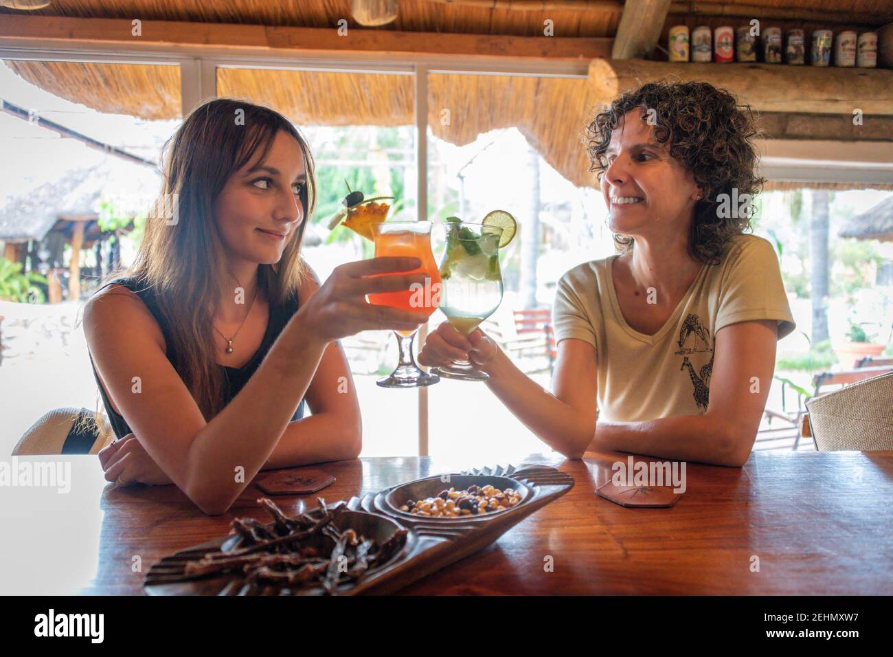 Two brunettes sit in hi-res stock photography and images - Alamy