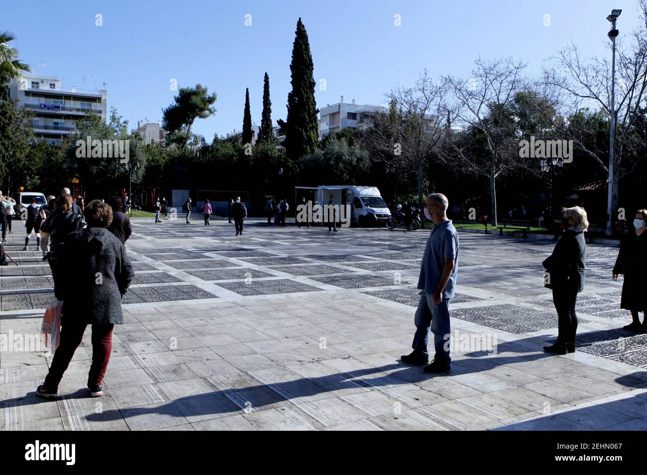 People wait in a queue to conduct rapid tests for the COVID-19 in Athens. The head of Greece’s medical association on Tuesday urged the government to agree to a tough lockdown of two to four weeks that would stem the progression of the novel coronavirus and especially its new, more virulent variant. Stock Photo