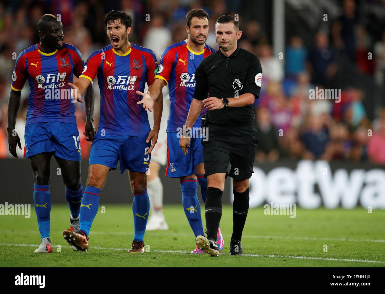 Soccer Football - Premier League - Crystal Palace v Liverpool - Selhurst Park, London, Britain - August 20, 2018  Crystal Palace players with referee Michael Oliver                    Action Images via Reuters/John Sibley  EDITORIAL USE ONLY. No use with unauthorized audio, video, data, fixture lists, club/league logos or 'live' services. Online in-match use limited to 75 images, no video emulation. No use in betting, games or single club/league/player publications.  Please contact your account representative for further details. Stock Photo