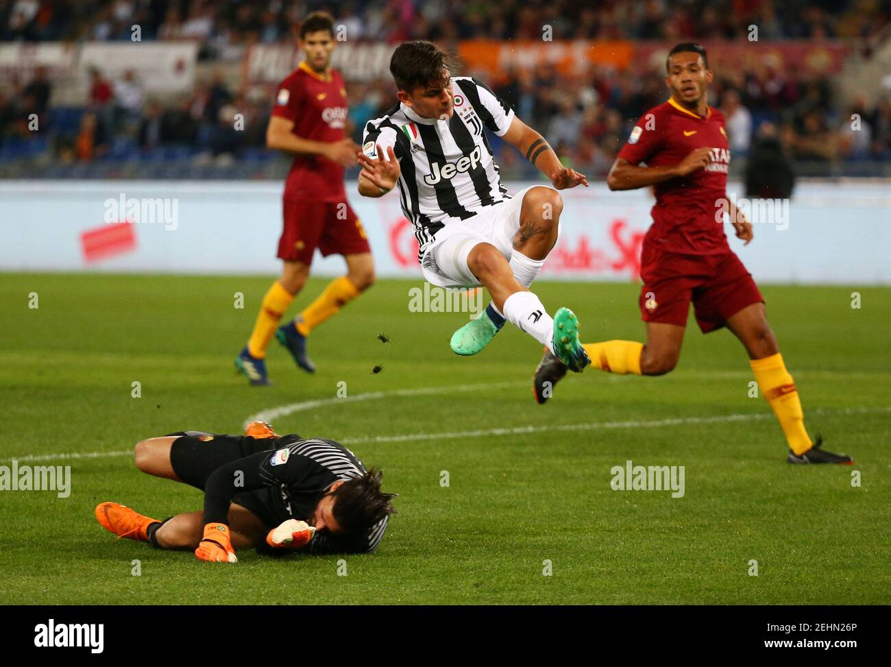 Soccer Football - Serie A - AS Roma vs Juventus - Stadio Olimpico, Rome, Italy - May 13, 2018   Juventus' Paulo Dybala in action with Roma's Alisson Becker    REUTERS/Alessandro Bianchi Stock Photo