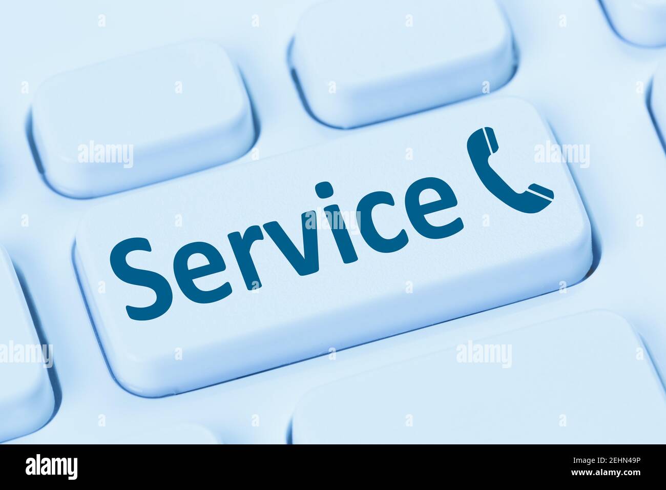 Service customer hotline telephone client support call calling blue symbol computer keyboard Stock Photo