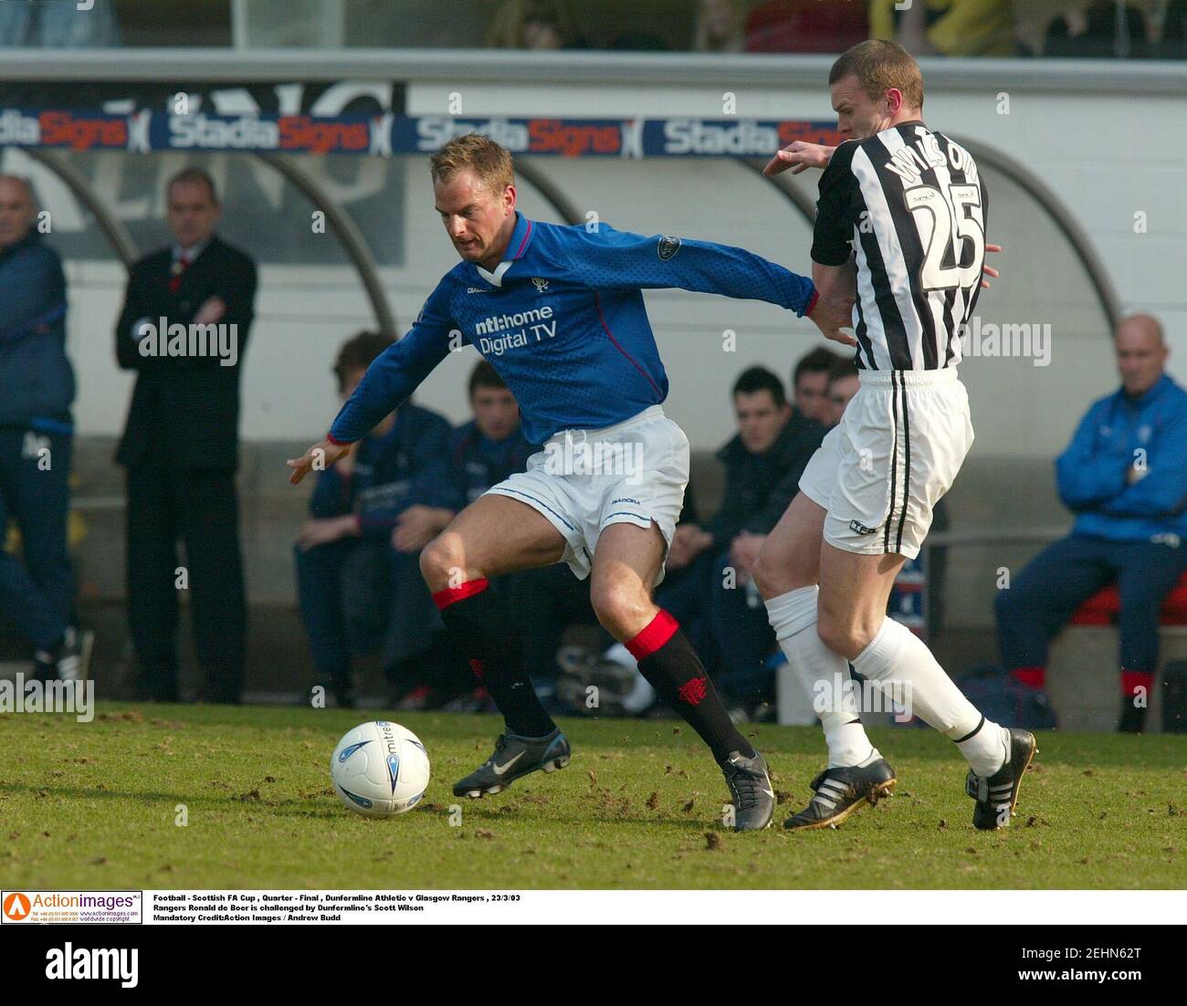 Football - Scottish FA Cup , Quarter - Final , Dunfermline Athletic v Glasgow Rangers , 23/3/03  Rangers Ronald de Boer is challenged by Dunfermline's Scott Wilson  Mandatory Credit:Action Images / Andrew Budd Stock Photo