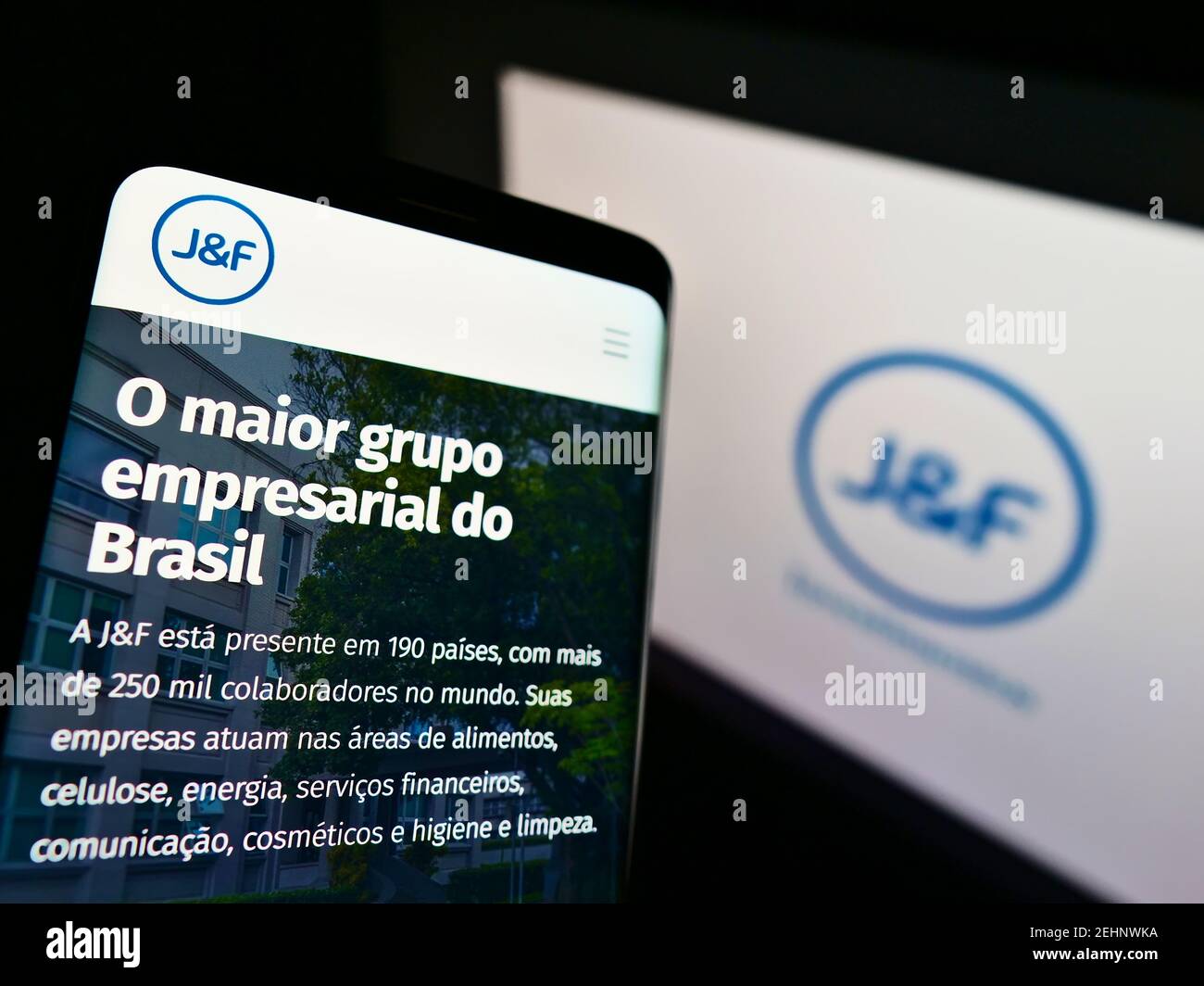 Smartphone with business web page of Brazilian investment company JF Investimentos SA on screen in front of logo. Focus on top of cellphone display. Stock Photo