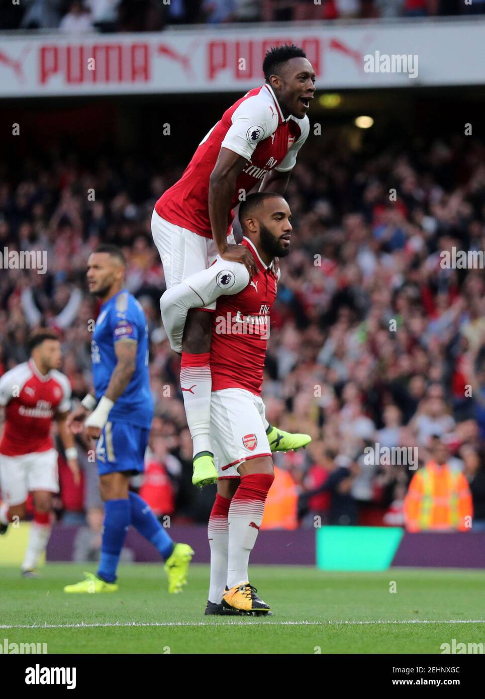 Football Soccer - Premier League - Arsenal vs Leicester City - London, Britain - August 11, 2017   Arsenal's Alexandre Lacazette celebrates scoring their first goal with Danny Welbeck   REUTERS/Eddie Keogh  EDITORIAL USE ONLY. No use with unauthorized audio, video, data, fixture lists, club/league logos or 'live' services. Online in-match use limited to 45 images, no video emulation. No use in betting, games or single club/league/player publications. Please contact your account representative for further details.? Stock Photo