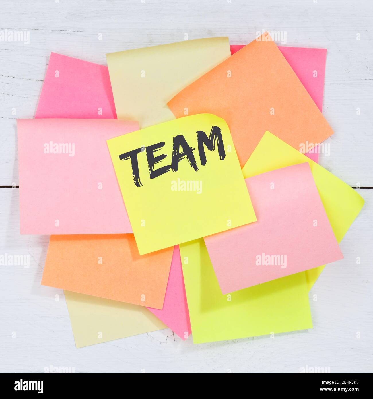 Team teamwork working together business concept desk note paper notepaper Stock Photo
