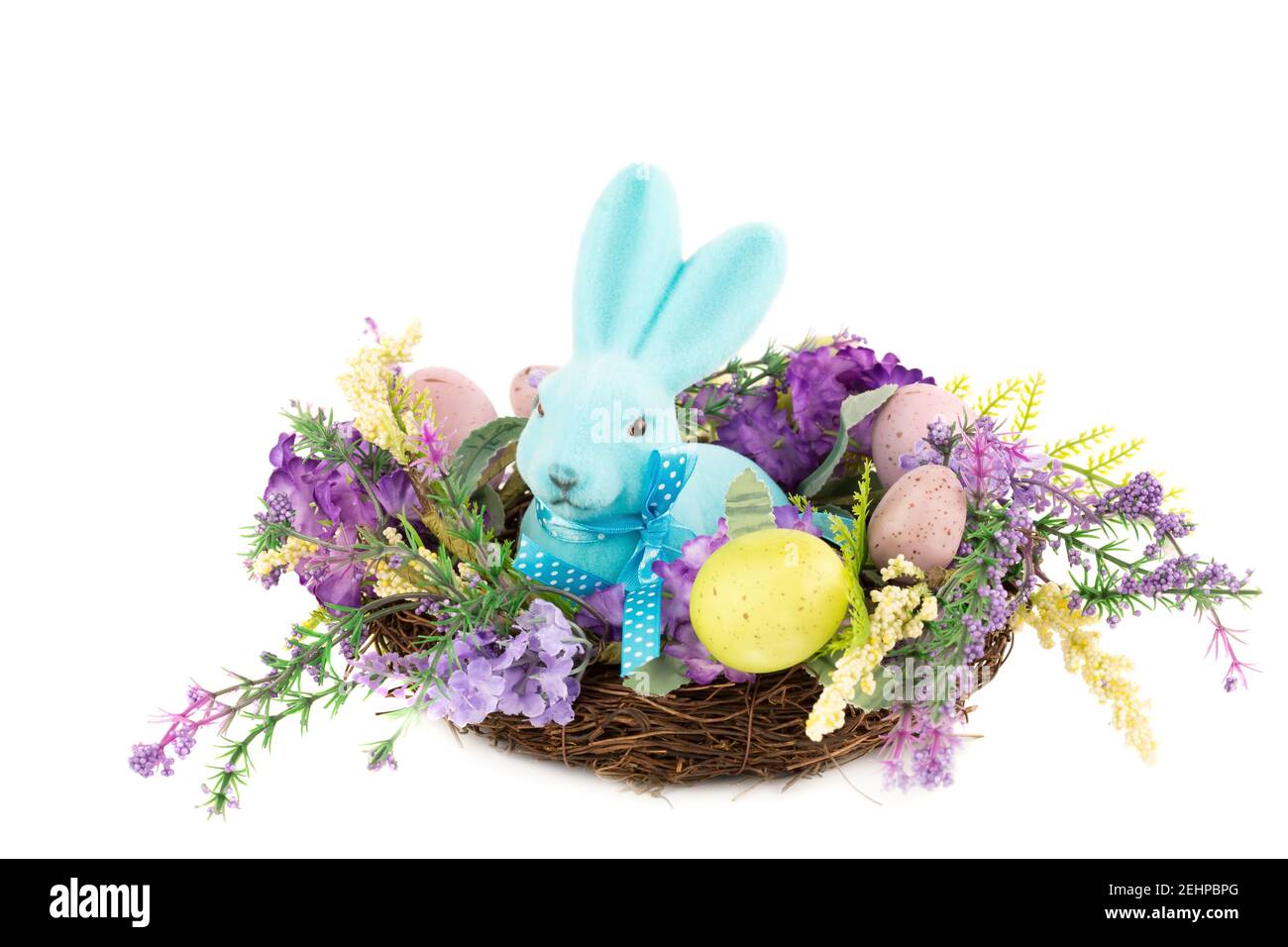 Easter colorful eggs and bunny in nest, flowers isolated on white ...