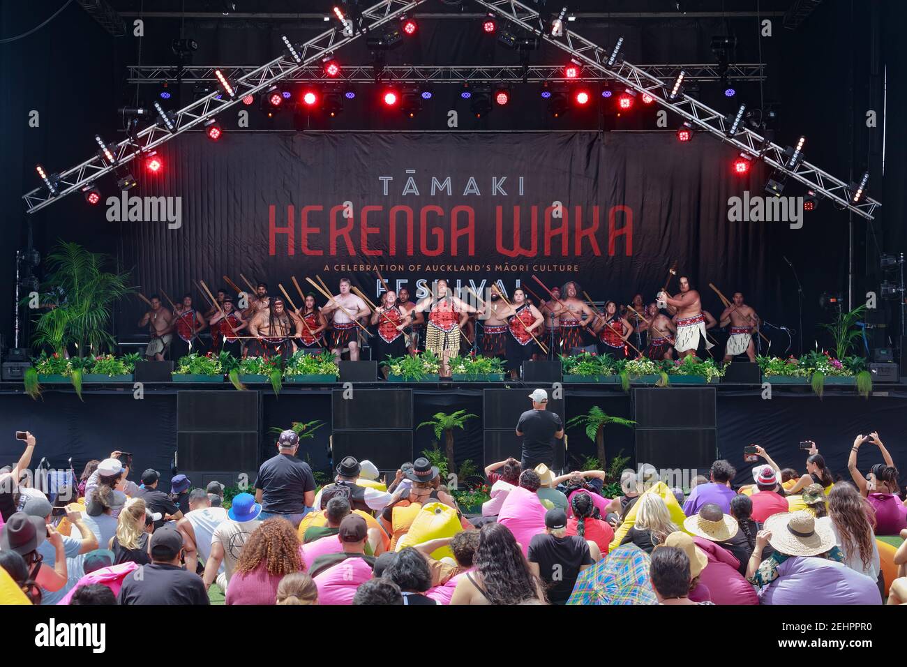 Maori dancers performing a haka in front of a crowd during the Tamaki Herenga Waka Festival, a celebration of Maori culture in Auckland, New Zealand Stock Photo