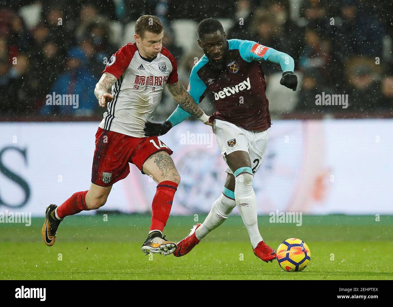 Soccer Football - Premier League - West Ham United vs West Bromwich Albion - London Stadium, London, Britain - January 2, 2018   West Ham United's Arthur Masuaku in action with West Bromwich Albion's James McClean    REUTERS/Eddie Keogh    EDITORIAL USE ONLY. No use with unauthorized audio, video, data, fixture lists, club/league logos or 'live' services. Online in-match use limited to 75 images, no video emulation. No use in betting, games or single club/league/player publications.  Please contact your account representative for further details. Stock Photo