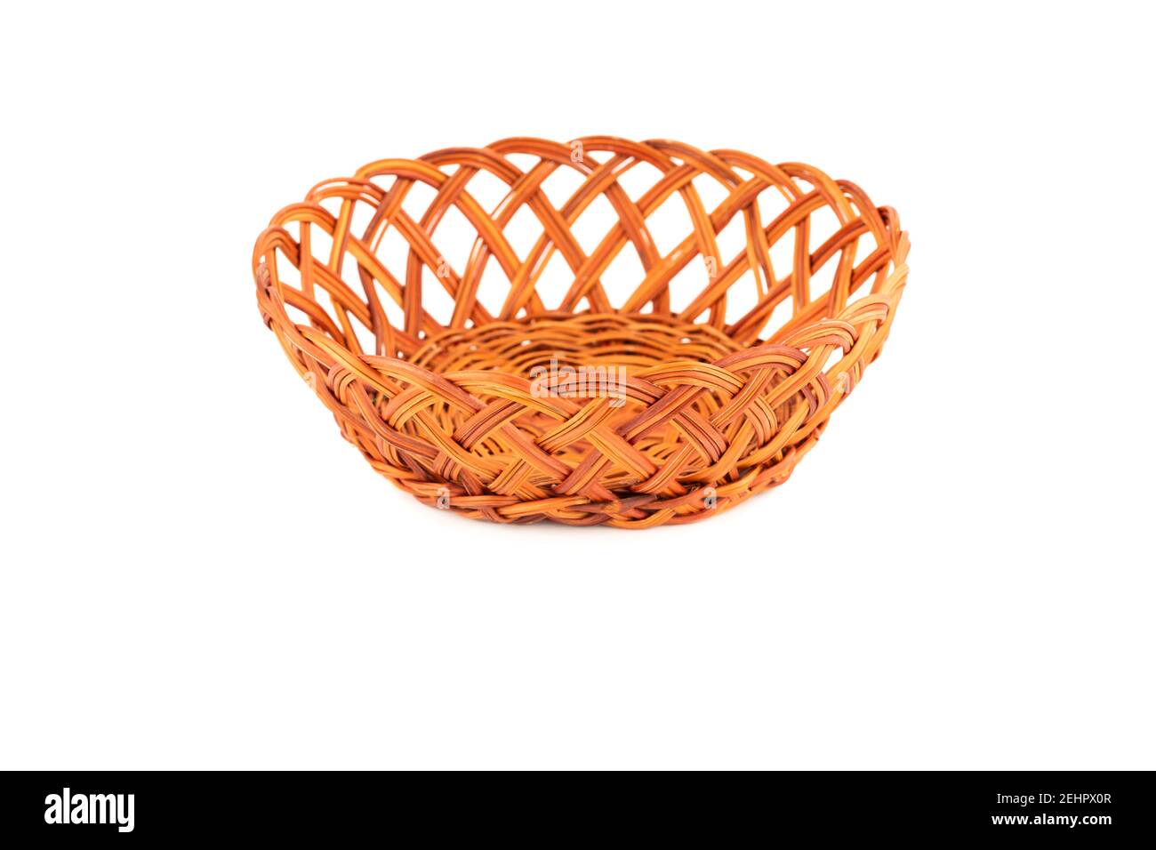 The empty wicker basket isolated on white background. Stock Photo