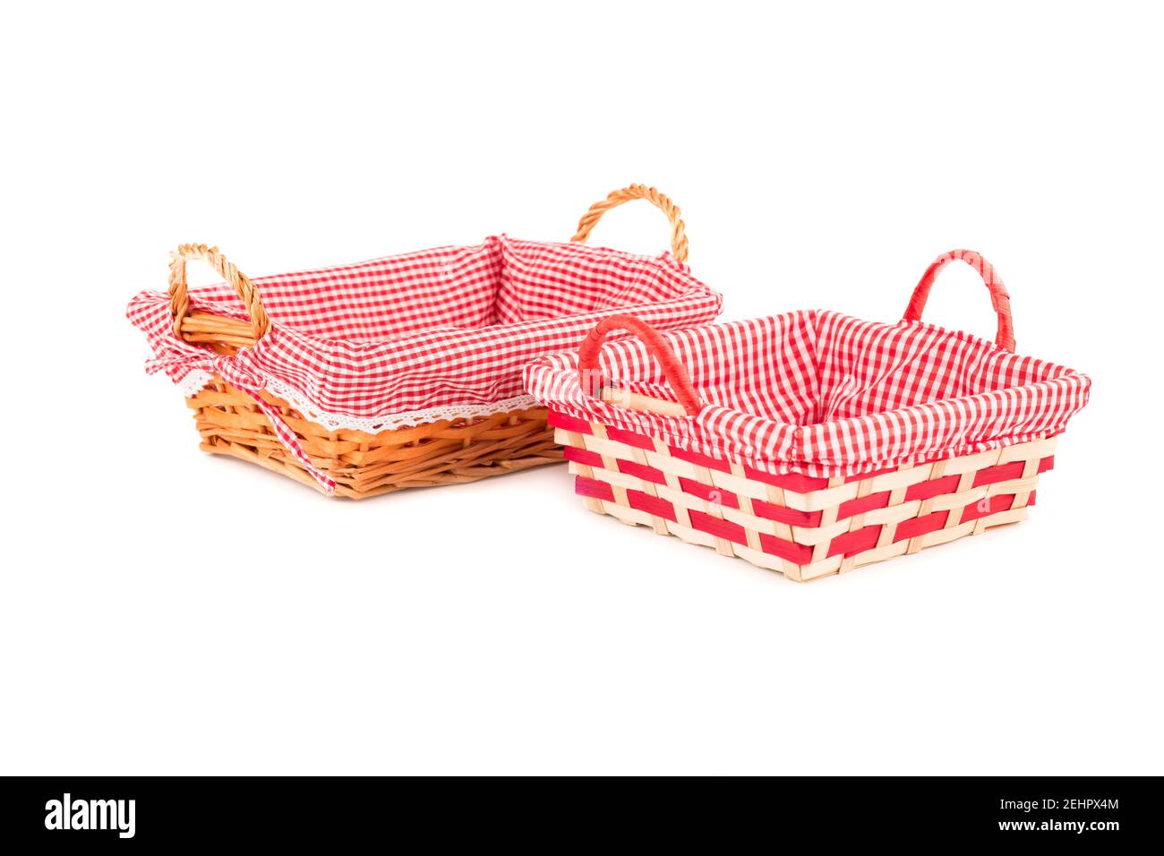Two empty wicker baskets isolated on white background. Stock Photo