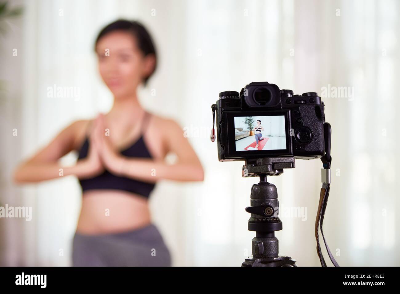 Fit woman practicing yoga Stock Photo