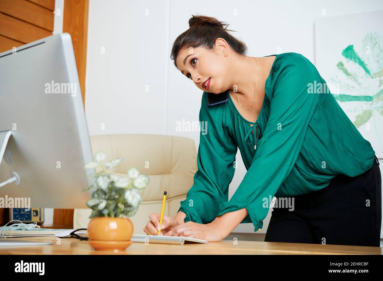 Female entrepreneur talking on phone Stock Photo