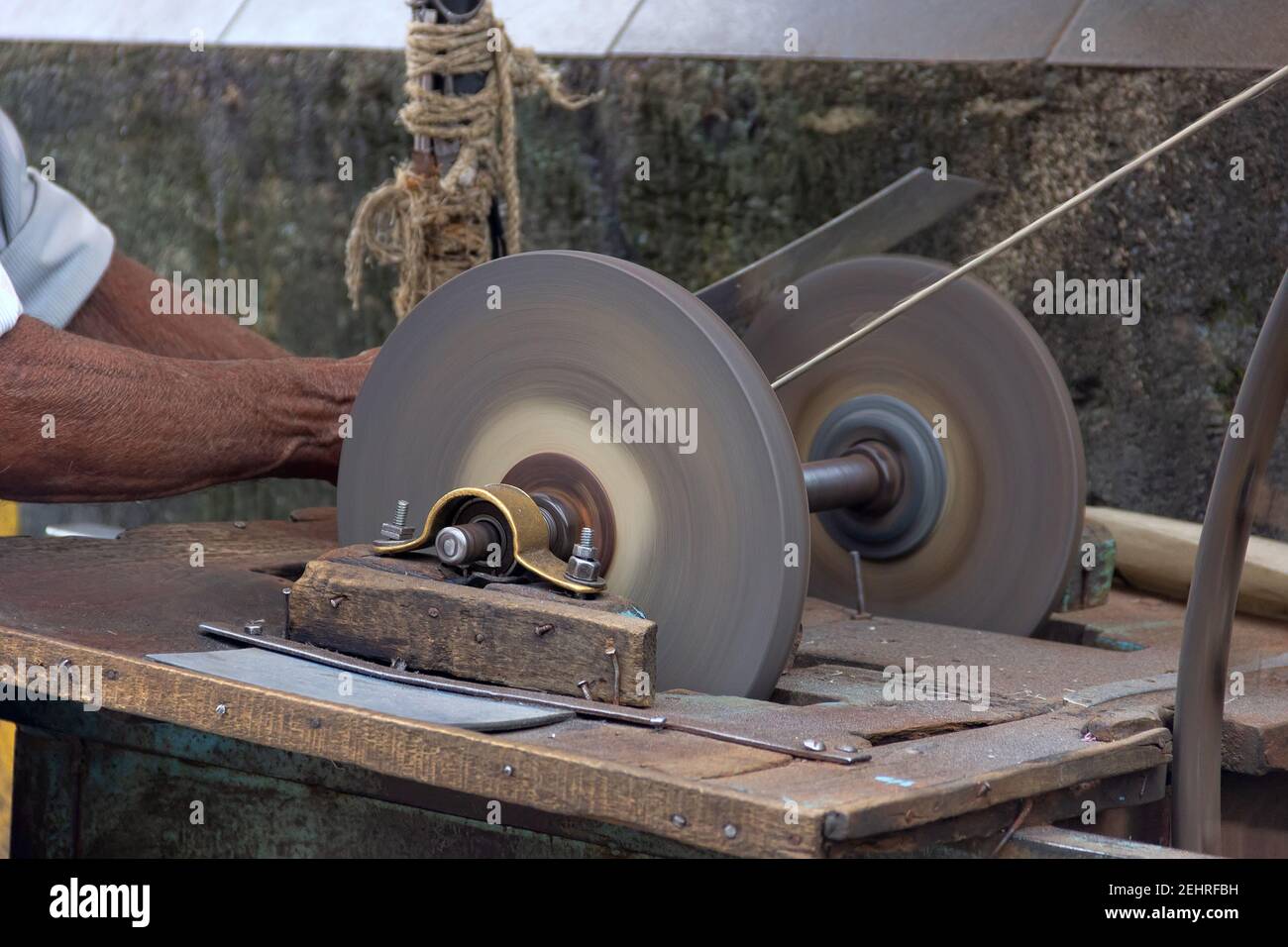 Street knife grinder with his homemade sharpening machine Knife