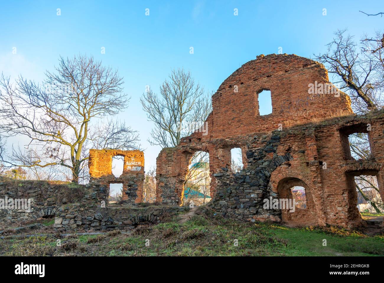 Ruined fortress against the blue sky. The ruins of an ancient fortress watchtower against the blue sky Stock Photo