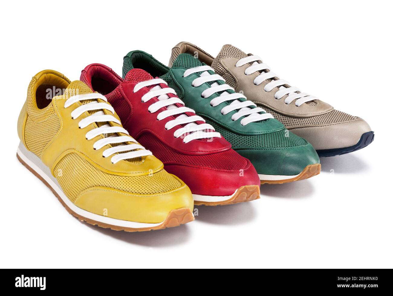 Group of four well-made sneakers with colored soles and matched laces ...