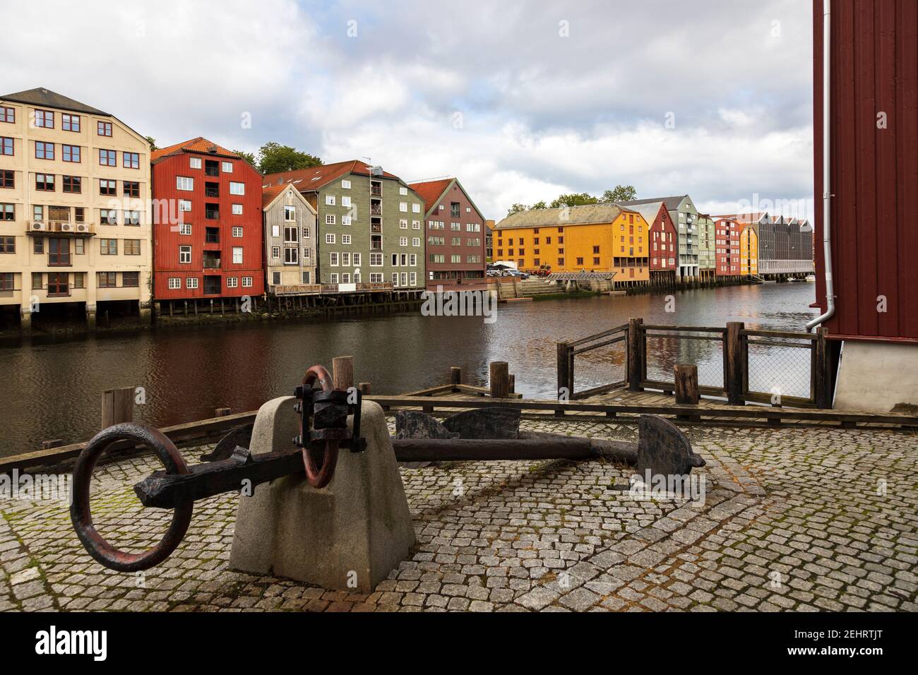 Ships anchor and colourful buildingsby the river Nidelva. Trondheim, Norway. Stock Photo