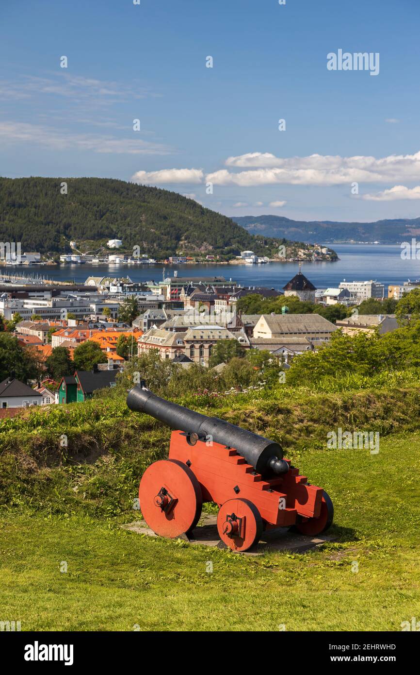 View of the city of Trondheim, Norway. A historic cannon in the foreground. Stock Photo