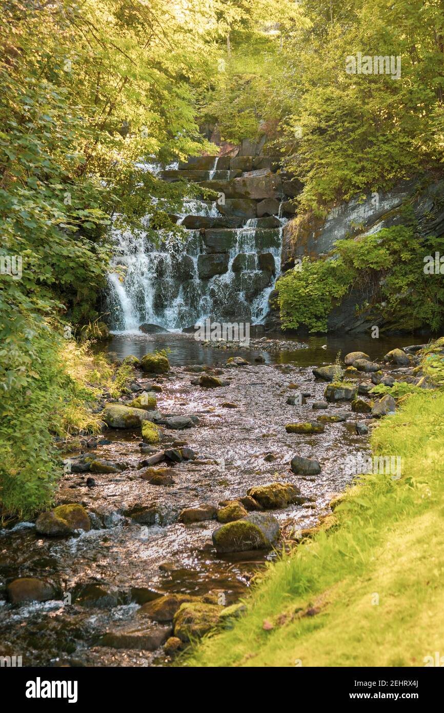 Man made woodland waterfall by the city of Trondheim, Norway. Stock Photo
