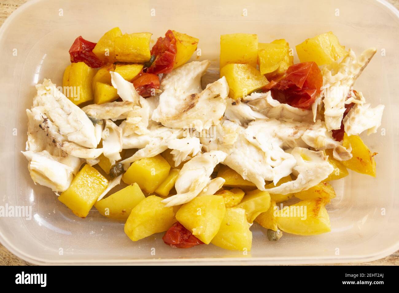 sea bass fillet with potatoes and cherry tomatoes Stock Photo