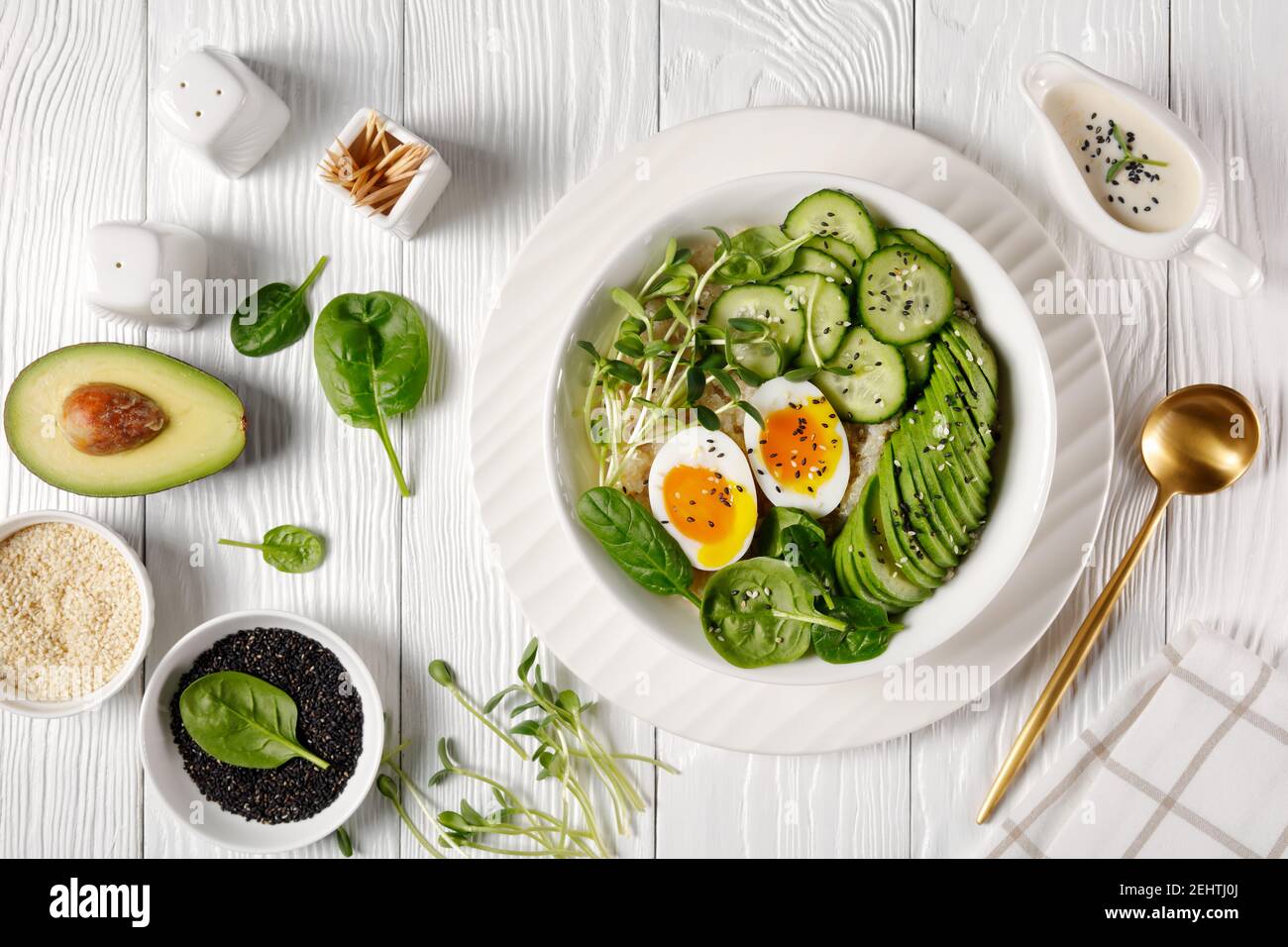 bowl with quinoa, sunflower microgreens, cucumber, avocado, baby