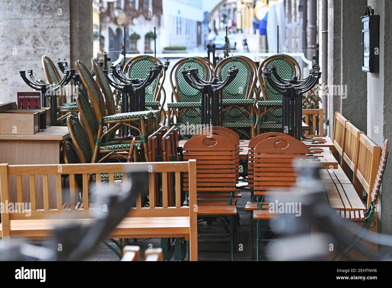 Topic picture: Coronavirus pandemic / consequences for the catering trade: chairs and tables stacked on top of one another on February 19, 2021 in front of Schuhbeck's Orlando. Orlando restaurant by Alfons SCHUHBECK at Platzl in Muenchen | usage worldwide Stock Photo