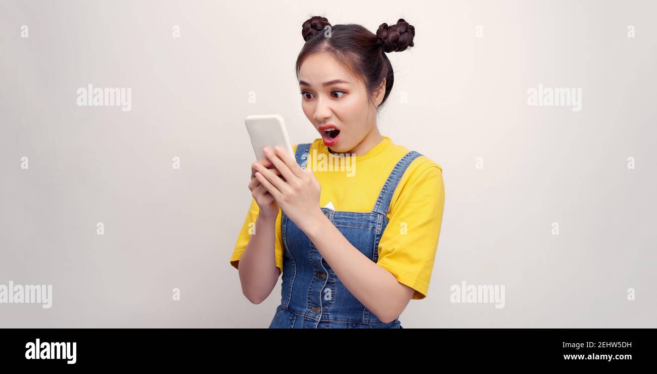 Photo of pretty funny excited lady open mouth hold telephone post youth blog read comments isolated white color background Stock Photo