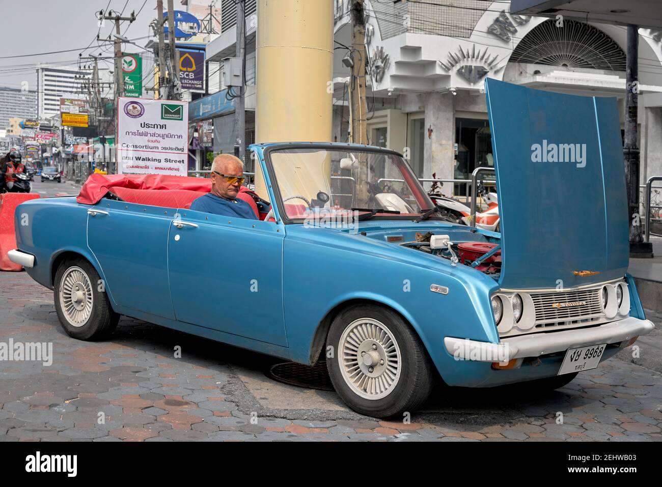 Toyota Corona convertible.  Rare convertible version of a vintage 1960s 4 door drop head car in sky blue with red interior. full length side view Stock Photo