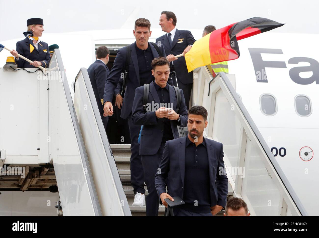Soccer Football - World Cup - Germany Arrival - Vnukovo International Airport, Moscow, Russia - June 12, 2018   Germany's Mesut Ozil and Sami Khedira with team mates as they arrive in Moscow   REUTERS/Sergei Karpukhin Stock Photo