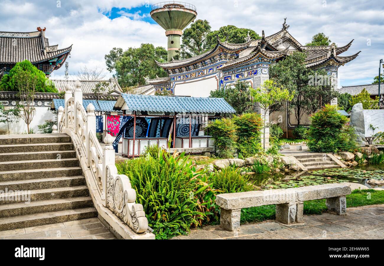 Scenic view of Dali Xizhou old town with ancient buildings stone bridge and water pond in Dali Xizhou Yunnan China Stock Photo