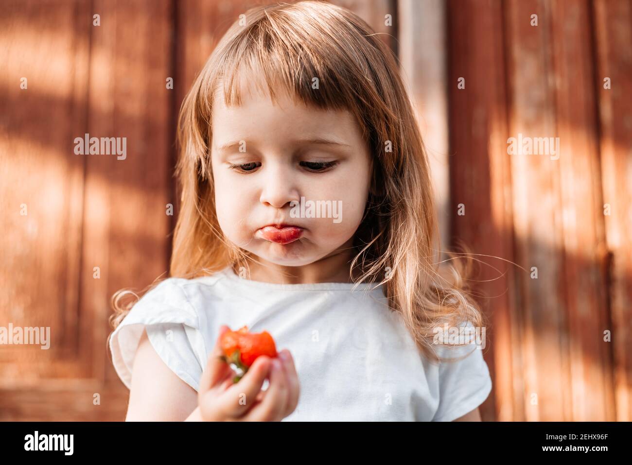 Child with food. Healthy eating Strawberry Stock Photo