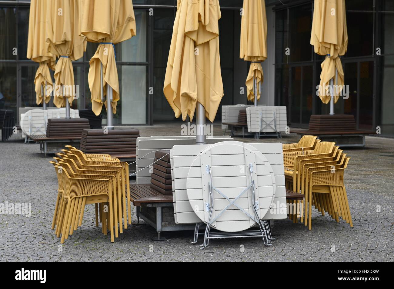 Munich. 19th Feb, 2021. Topic picture: Coronavirus pandemic/Consequences for gastronomy: chairs and tables stacked on top of each other on February 19, 2021 in Munich. | usage worldwide Credit: dpa/Alamy Live News Stock Photo