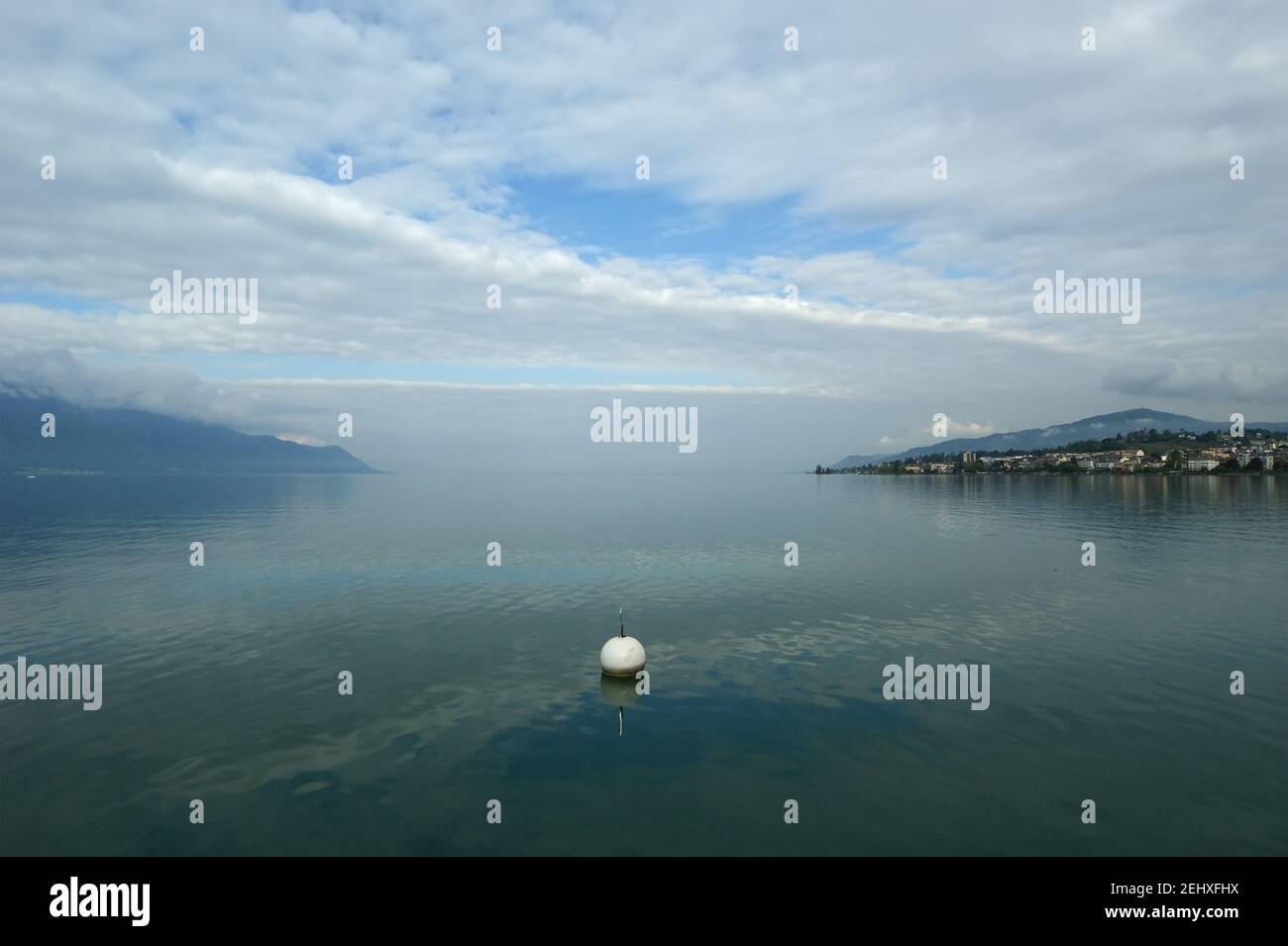 Switzerland, Montreux, view of Lake Geneva and the Alps in cloudy ...