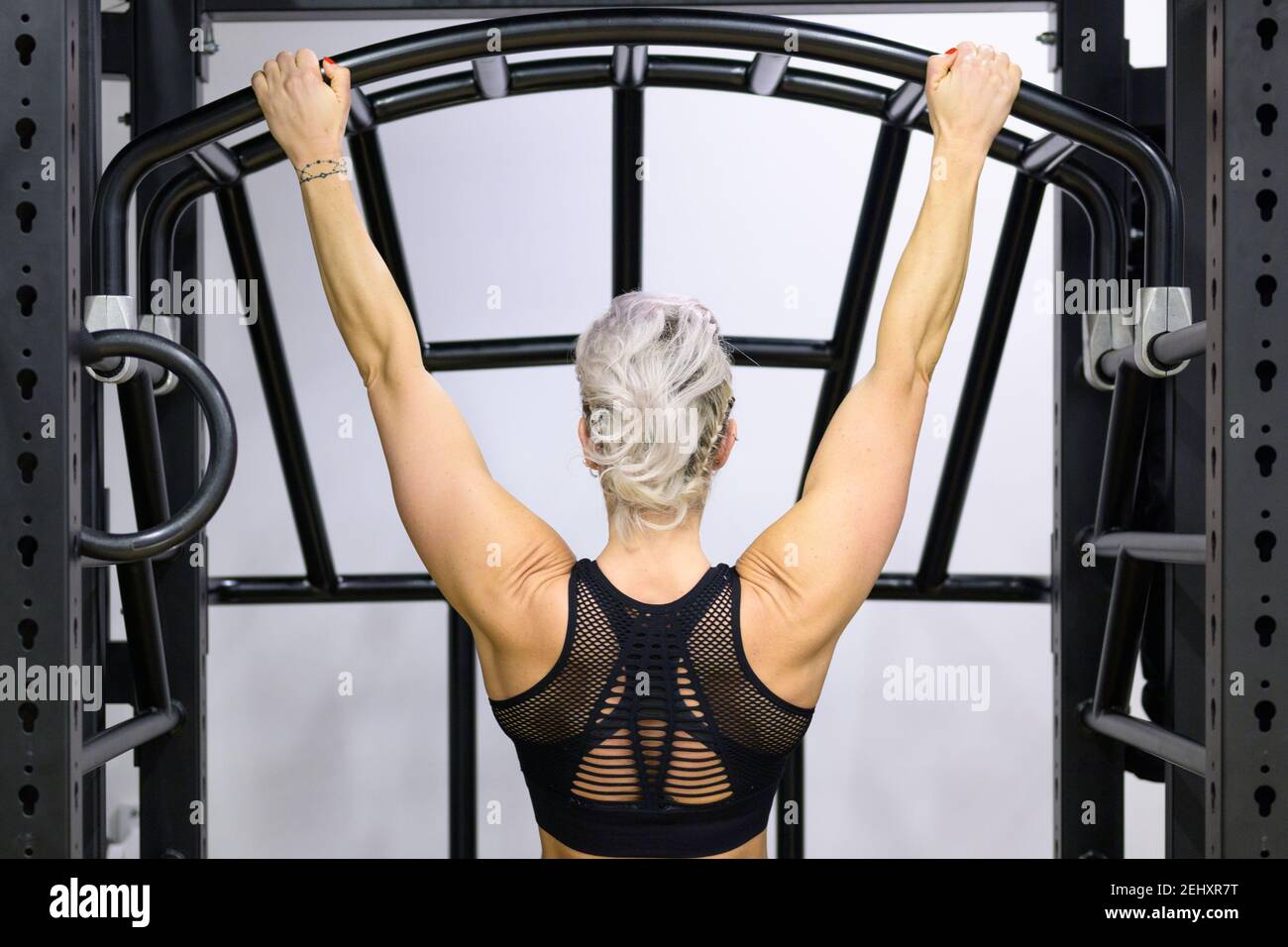 Woman flexing her muscles and showing her toned back Royalty-Free Stock  Image - Storyblocks