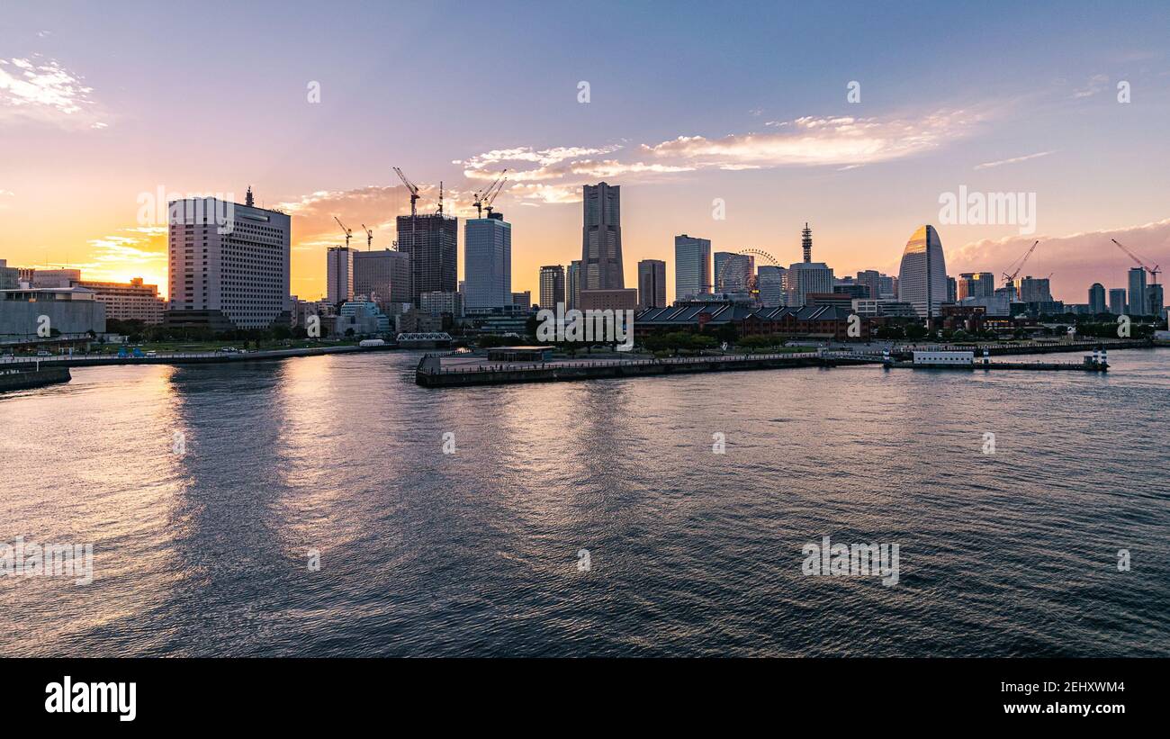 Colorful sunset over the buildings at the Yokohama Ferry Terminal. Stock Photo