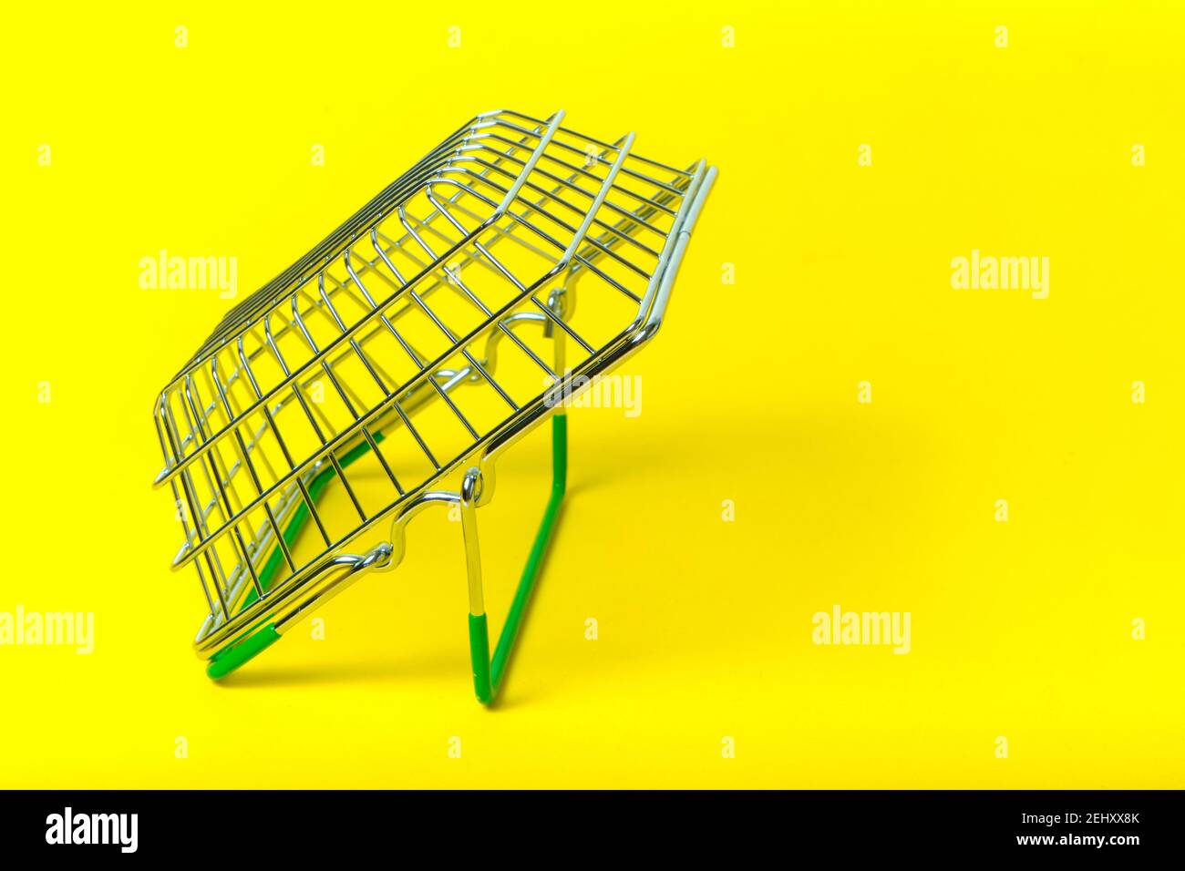 Empty green yellow basket hi-res stock photography and images - Alamy