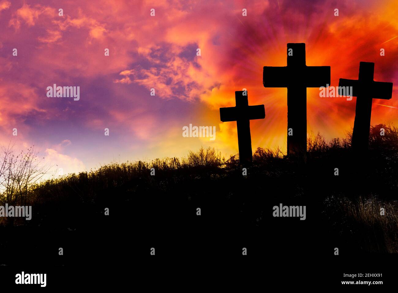 three crosses on the hill, symbols of the crucifixion of Jesus Christ Stock Photo