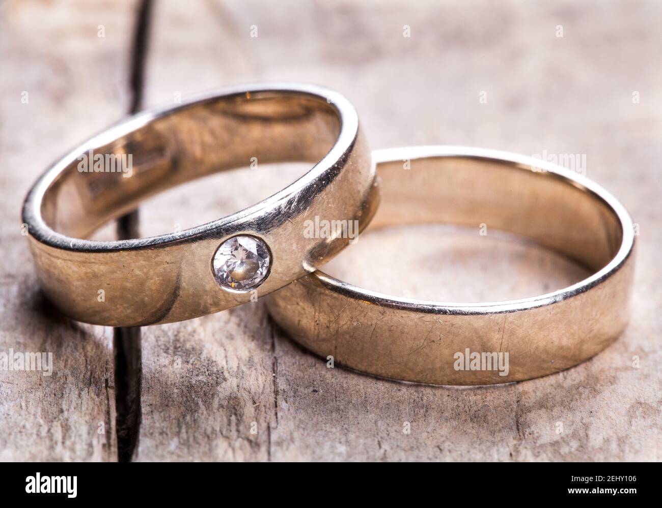 old Wedding rings on wooded background, old Stock Photo