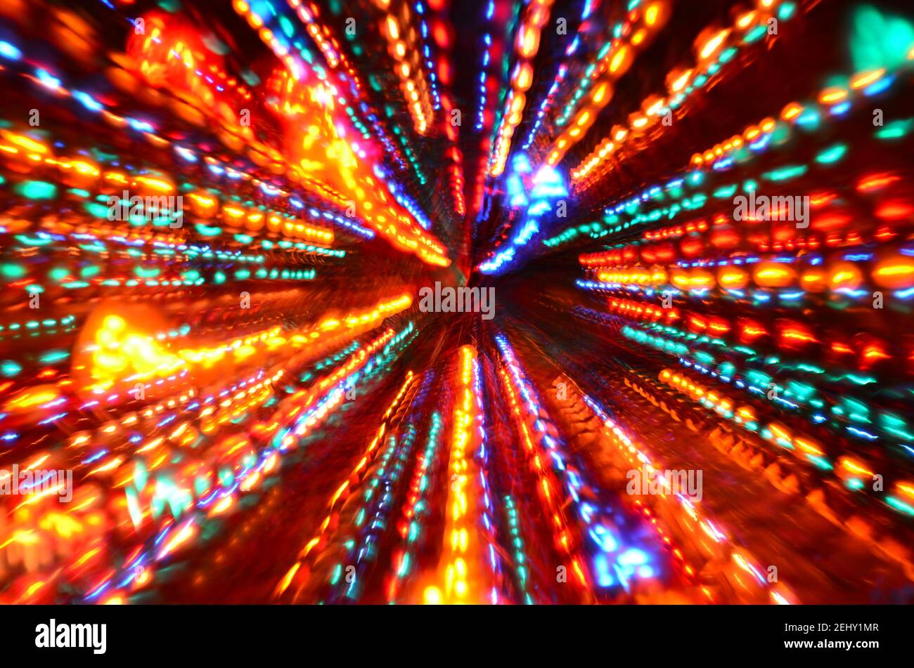 Multi-colored explosion of lights on dark background Stock Photo - Alamy