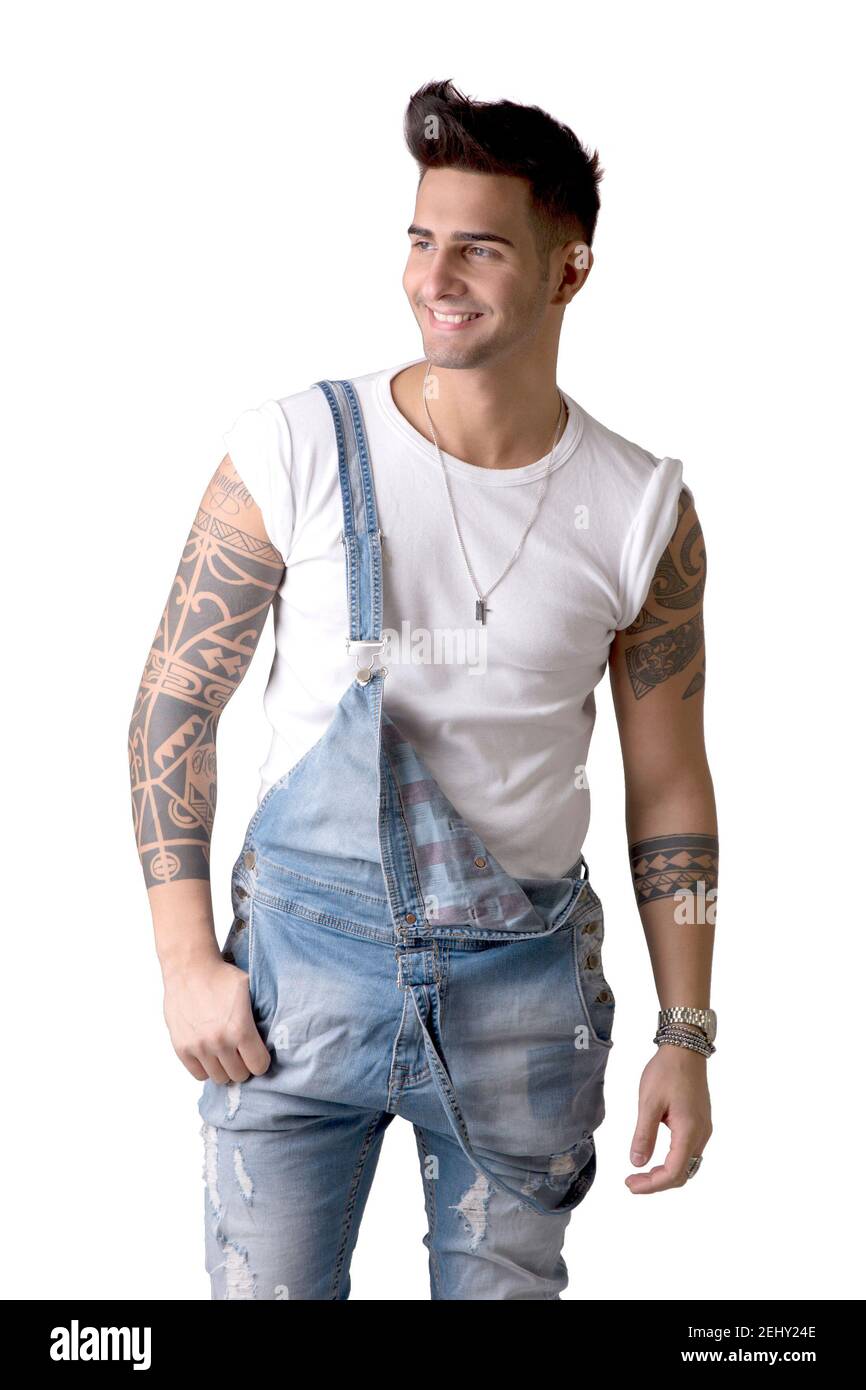 Young man wearing denim overalls and white t-shirt Stock Photo