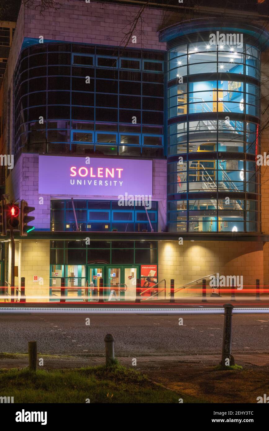 Front view of / entrance to Solent University illuminated at night in Southampton, England, UK Stock Photo